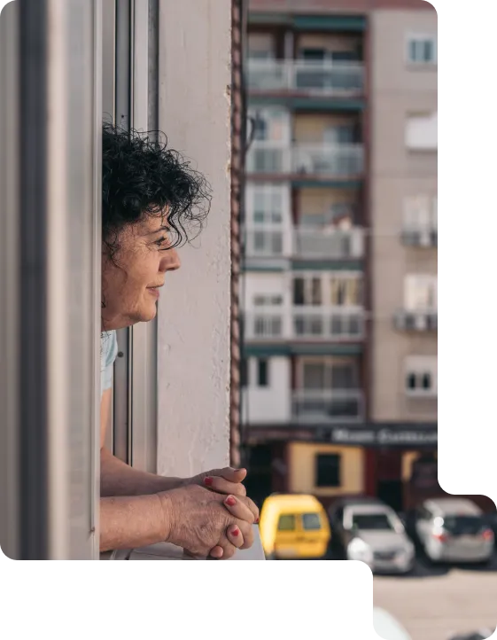 Woman looking through a window